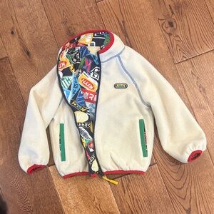 Kith Kids Reversible Cream Fleece Jacket with travel/passport design